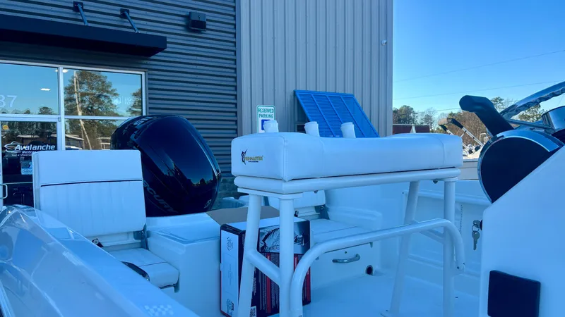 Slide: The Image of 2025 Bayliner T18 Limited Edition boat with seating and motor, displayed outdoors. - 5