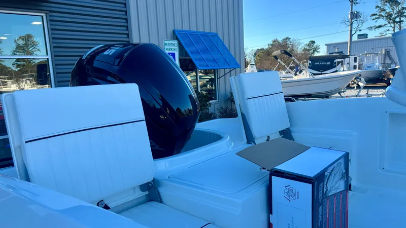 Slide: The Image of 2025 Bayliner T18 Limited Edition boat interior with seating and motor. - 6