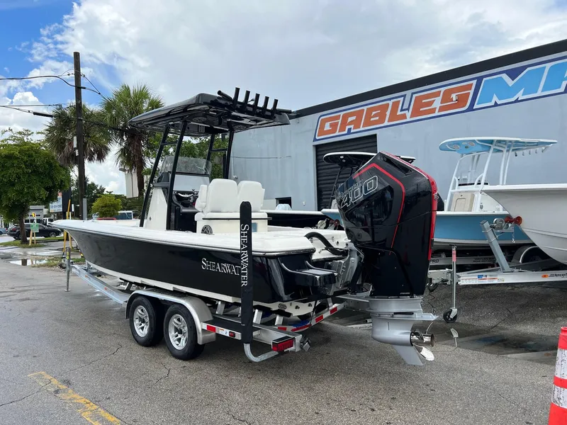 Slide: The Image of 2024 ShearWater 260 Carolina Flare boat on trailer, parked outdoors. - 3