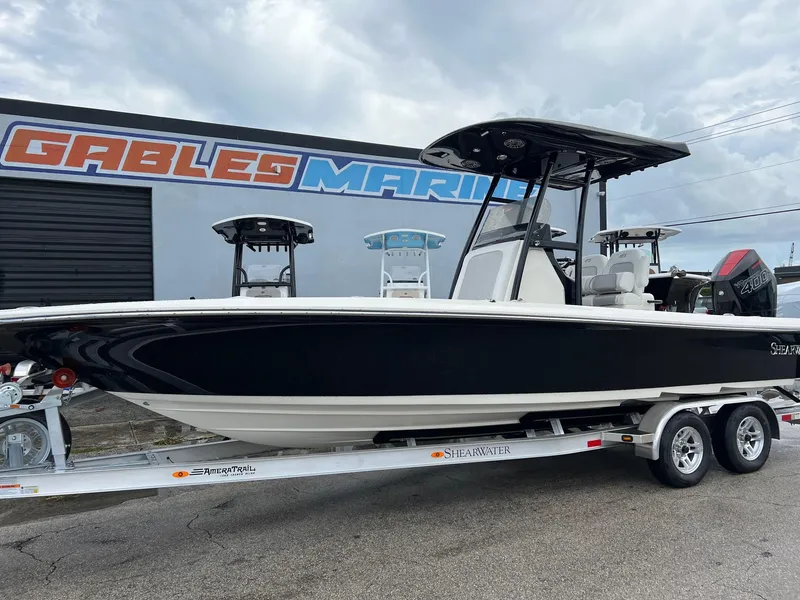 Slide: The Image of 2024 ShearWater 260 Carolina Flare boat on trailer at Gables Marine dealership. - 4