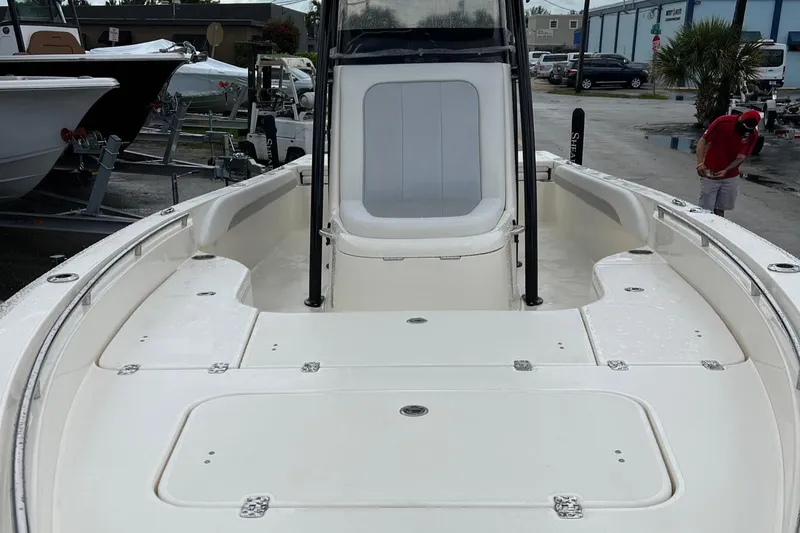Slide: The Image of 2024 ShearWater 260 Carolina Flare boat, spacious deck view, parked outdoors. - 9