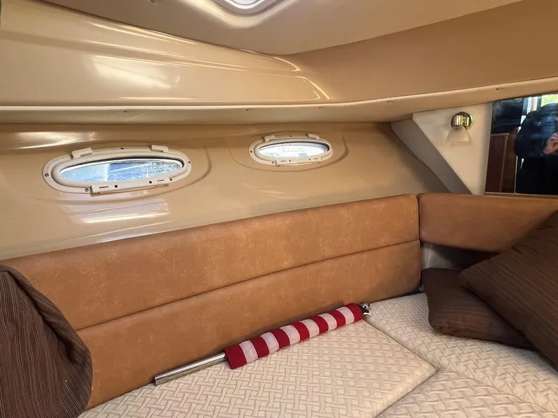 Slide: The Image of Interior cabin of 2016 Cutwater C-28 boat with cozy seating and porthole windows. - 44