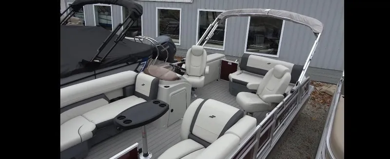 Slide: The Image of 2025 Starcraft EX 22 Q pontoon boat with spacious seating and modern design. - 2