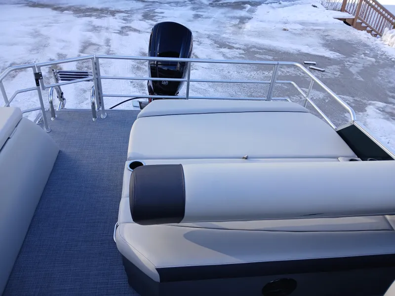 Slide: The Image of 2025 Starcraft EX 22 Q pontoon boat with spacious deck and sleek design. - 5