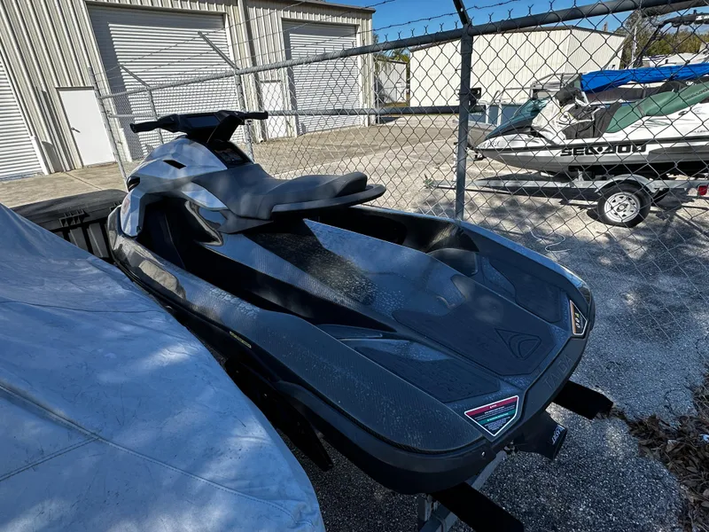 Slide: The Image of 2022 Orca Carbon jet ski parked in a fenced storage area. - 4