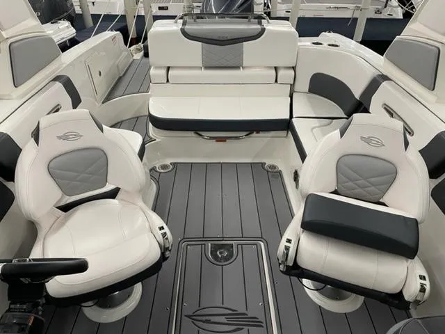 Slide: The Image of 2021 Chaparral 267 SSX OB boat interior with luxurious seating and modern design. - 12