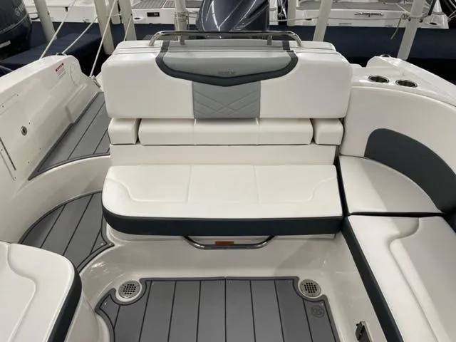 Slide: The Image of 2021 Chaparral 267 SSX OB boat interior with white and gray seating. - 14
