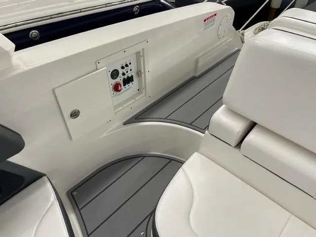 Slide: The Image of 2021 Chaparral 267 SSX OB boat interior with control panel and seating. - 17