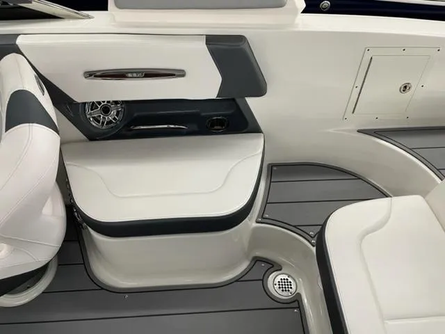 Slide: The Image of 2021 Chaparral 267 SSX OB boat interior with sleek seating and modern design. - 18