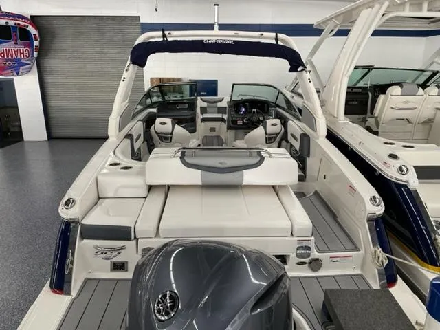 Slide: The Image of 2021 Chaparral 267 SSX OB boat interior with seating and controls. - 3