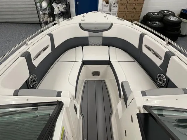 Slide: The Image of 2021 Chaparral 267 SSX OB boat interior with gray and white seating. - 4