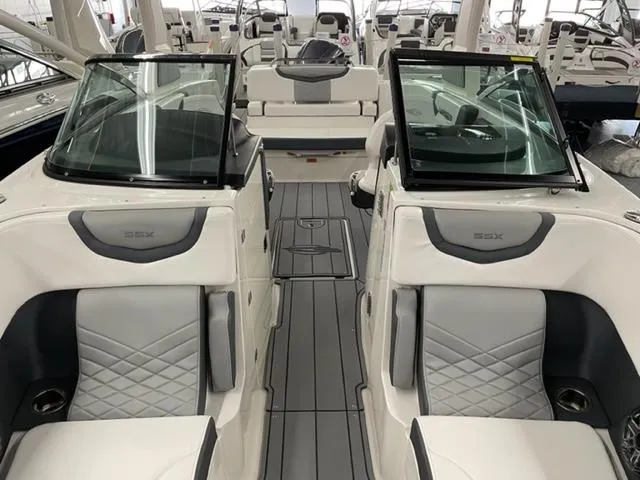 Slide: The Image of 2021 Chaparral 267 SSX OB boat interior with luxurious seating and modern design. - 5