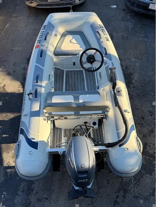 Slide: The Image of 2023 Highfield Classic 310 FCT inflatable boat with steering console and outboard motor. - 3