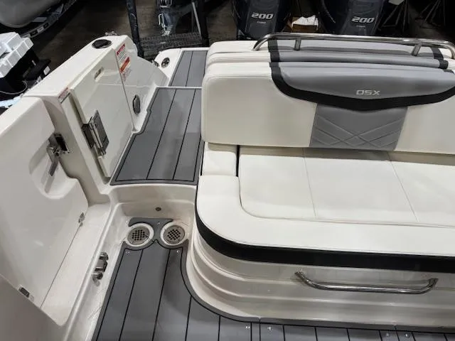 Slide: The Image of 2022 Chaparral 280 OSX boat interior with sleek seating and modern design. - 26