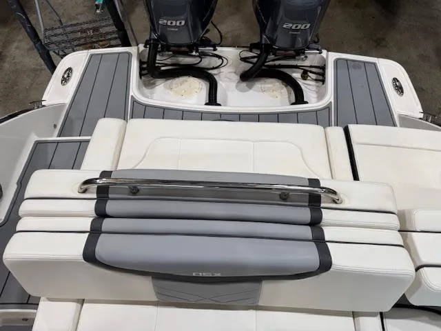 Slide: The Image of 2022 Chaparral 280 OSX boat with dual engines and sleek seating design. - 27