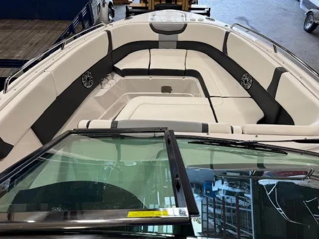 Slide: The Image of 2022 Chaparral 280 OSX boat interior with spacious seating and sleek design. - 4