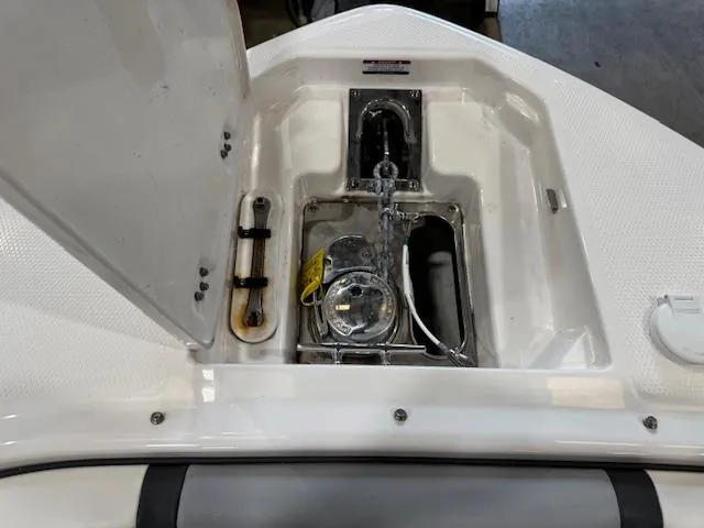 Slide: The Image of 2022 Chaparral 280 OSX boat anchor compartment with open hatch. - 5