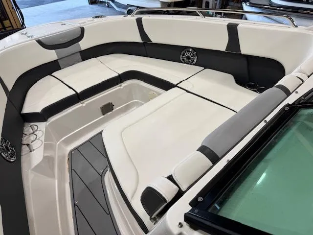 Slide: The Image of 2022 Chaparral 280 OSX boat interior with spacious seating and modern design. - 6