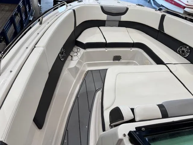 Slide: The Image of 2022 Chaparral 280 OSX boat interior with sleek seating and modern design. - 7