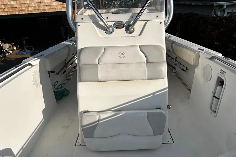 Slide: The Image of Edgewater 228CC 2010 boat interior with seating and console. - 15