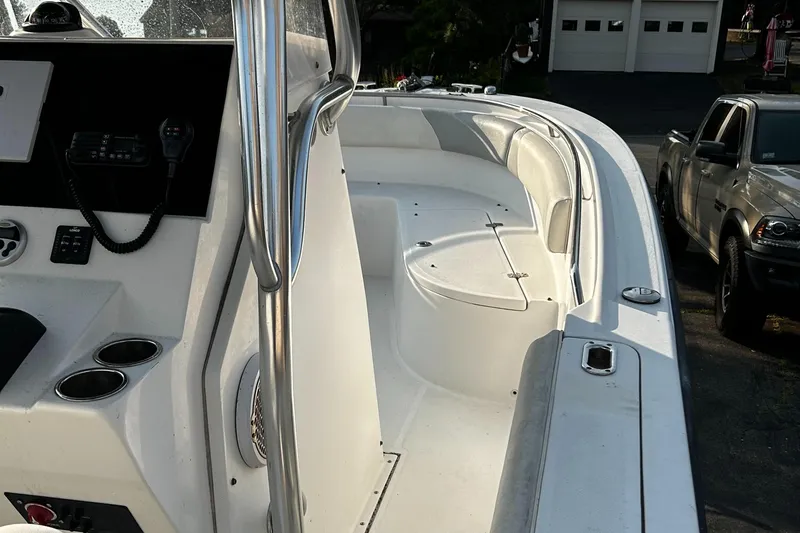 Slide: The Image of Edgewater 228CC 2010 boat interior with seating and control panel. - 9