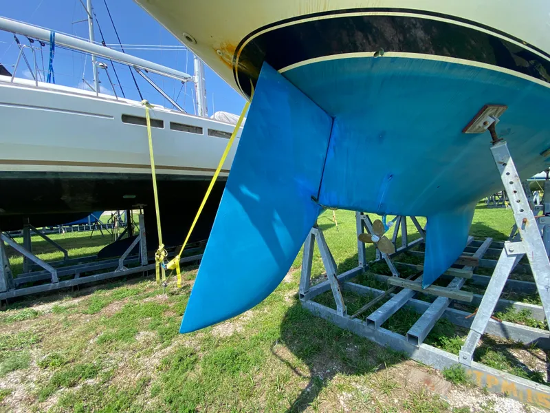 Slide: The Image of Ericson 39 Flushdeck 1972 sailboat on stands, showing blue keel and rudder. - 14