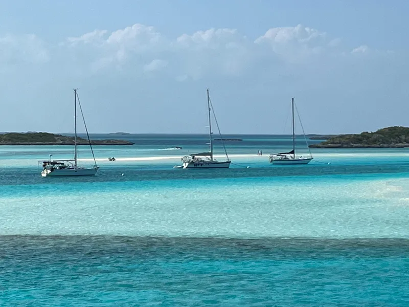Slide: The Image of Three sailboats on turquoise waters, Ericson 39 Flushdeck, 1972 model. - 2