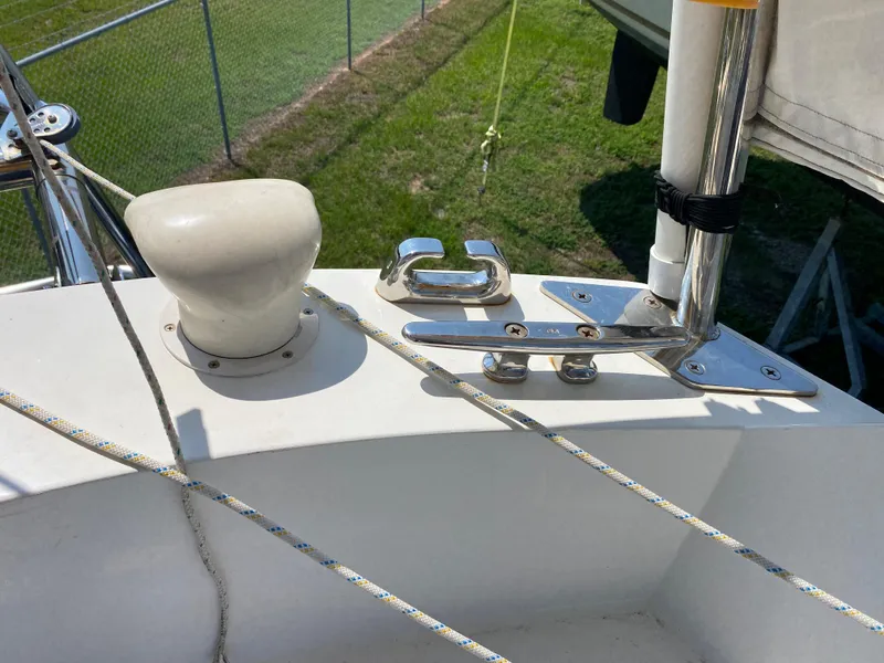 Slide: The Image of Ericson 39 Flushdeck 1972 sailboat deck with cleat and winch. - 25