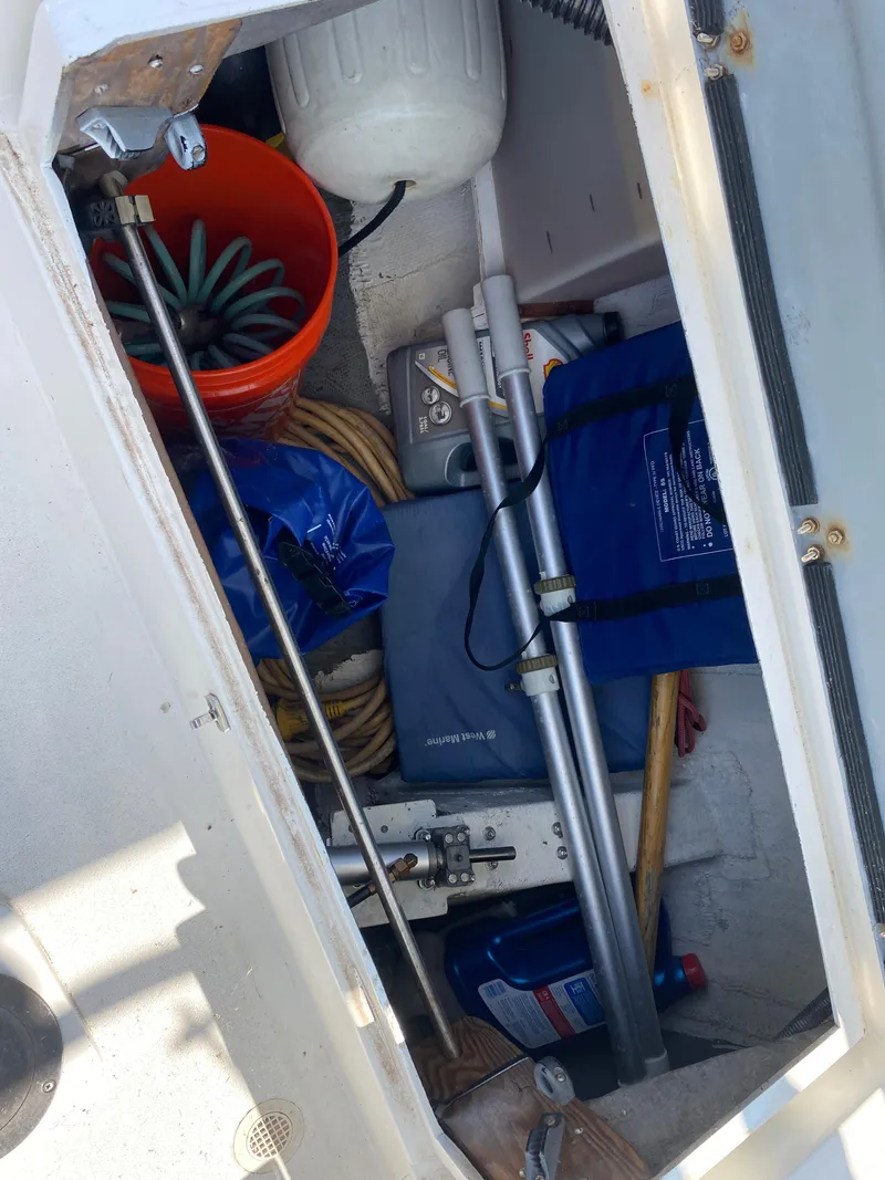 Slide: The Image of Storage compartment of 1972 Ericson 39 Flushdeck sailboat with equipment and supplies. - 31