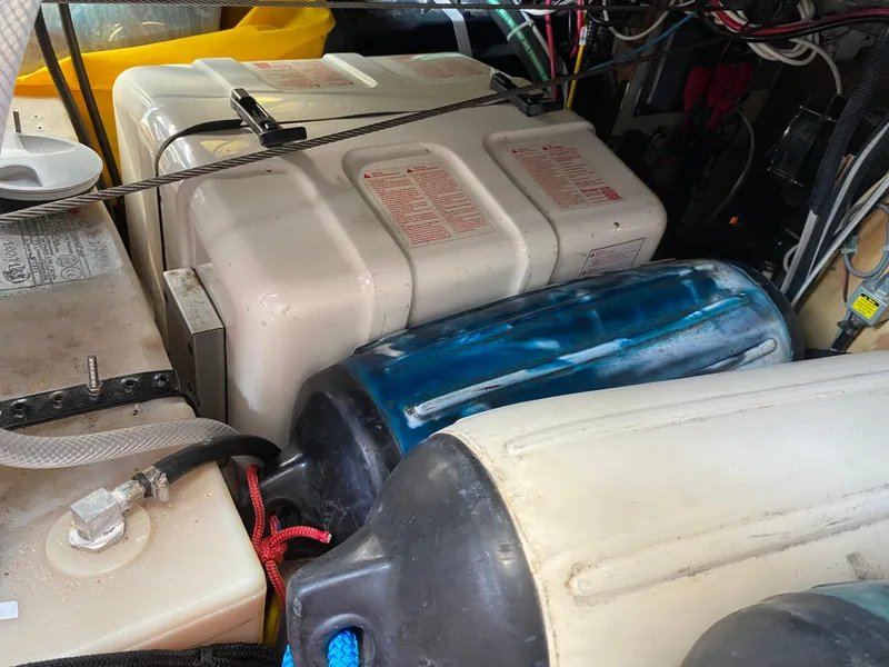 Slide: The Image of Engine compartment of a 1972 Ericson 39 Flushdeck sailboat with fuel and water tanks. - 32