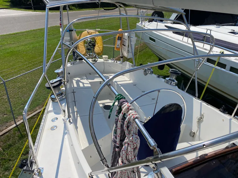 Slide: The Image of 1972 Ericson 39 Flushdeck sailboat cockpit with ropes and safety equipment. - 40