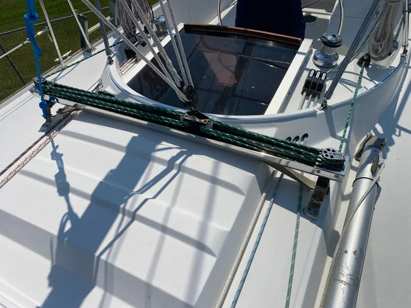 Slide: The Image of 1972 Ericson 39 Flushdeck sailboat deck with rigging and hatch. - 42