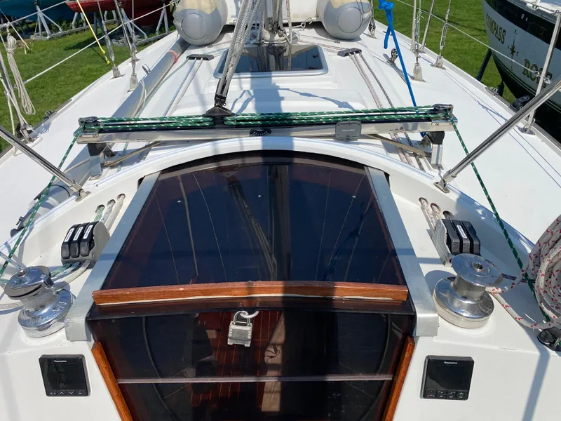Slide: The Image of Ericson 39 Flushdeck 1972 sailboat deck with winches and hatch. - 44
