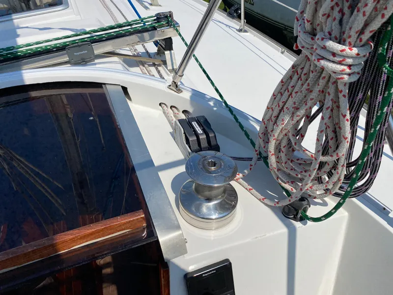 Slide: The Image of Close-up of 1972 Ericson 39 Flushdeck sailboat winch and rigging. - 46