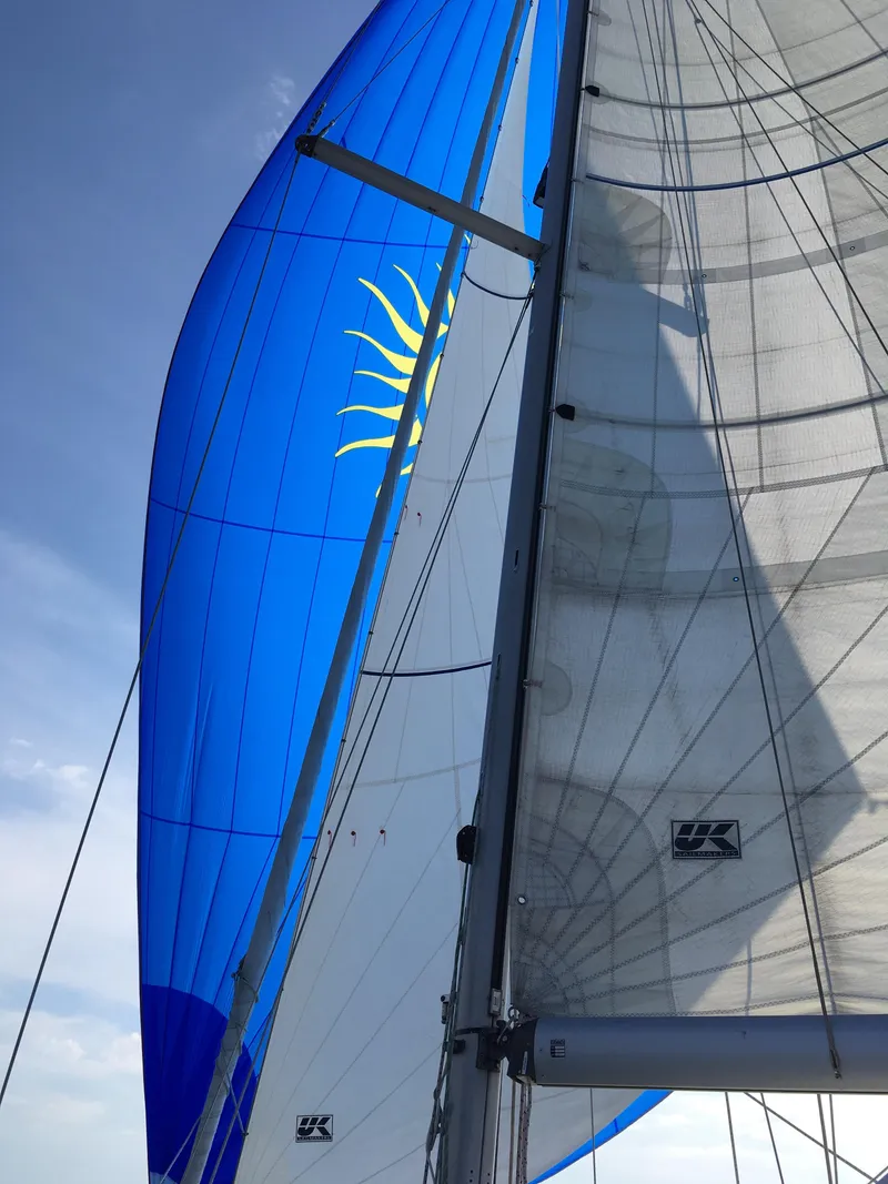 Slide: The Image of Sailing yacht Ericson 39 Flushdeck 1972 with vibrant blue and white sails. - 5