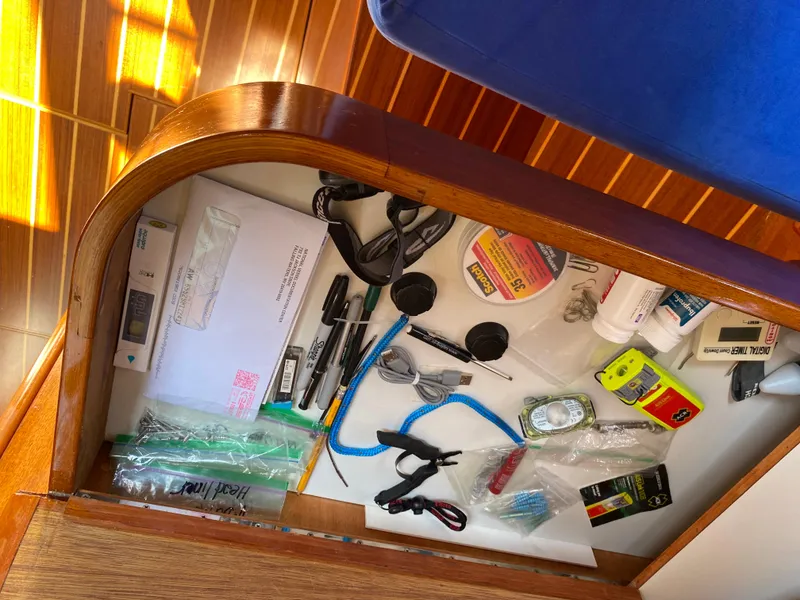 Slide: The Image of Drawer with assorted tools and supplies on a 1972 Ericson 39 Flushdeck sailboat. - 81