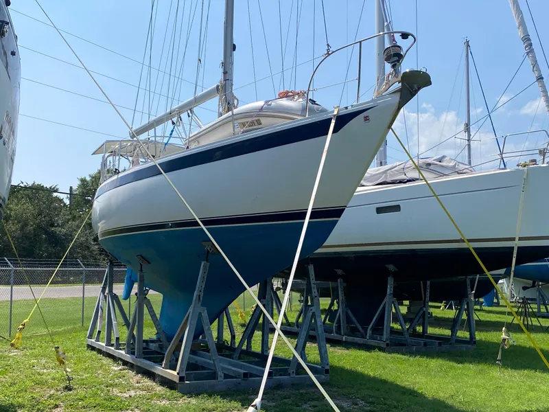 Slide: The Image of 1972 Ericson 39 Flushdeck sailboat on stands, displayed outdoors. - 9