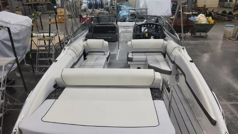 Slide: The Image of 2024 Formula 270 Bowrider boat interior with spacious seating in a workshop setting. - 14