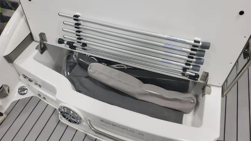 Slide: The Image of 2024 Formula 270 Bowrider storage compartment with neatly arranged equipment and accessories. - 15