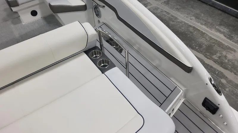 Slide: The Image of 2024 Formula 270 Bowrider interior with white seating and cup holders. - 16