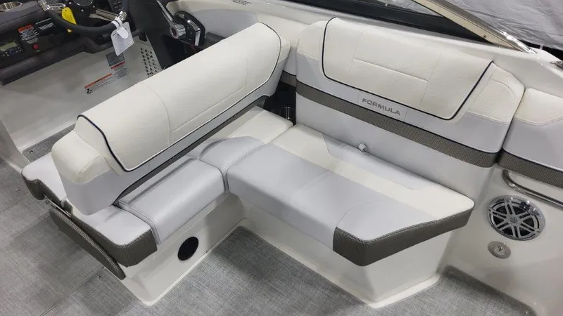 Slide: The Image of 2024 Formula 270 Bowrider interior seating with white and gray upholstery. - 21