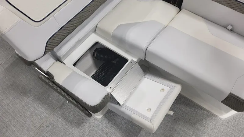 Slide: The Image of 2024 Formula 270 Bowrider interior with open storage compartment and cushioned seating. - 23