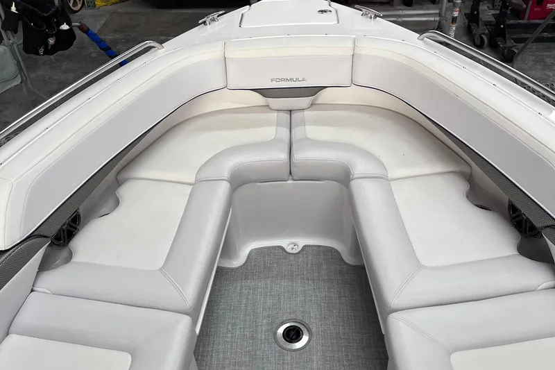 Slide: The Image of 2024 Formula 270 Bowrider boat with luxurious white seating and modern design. - 33