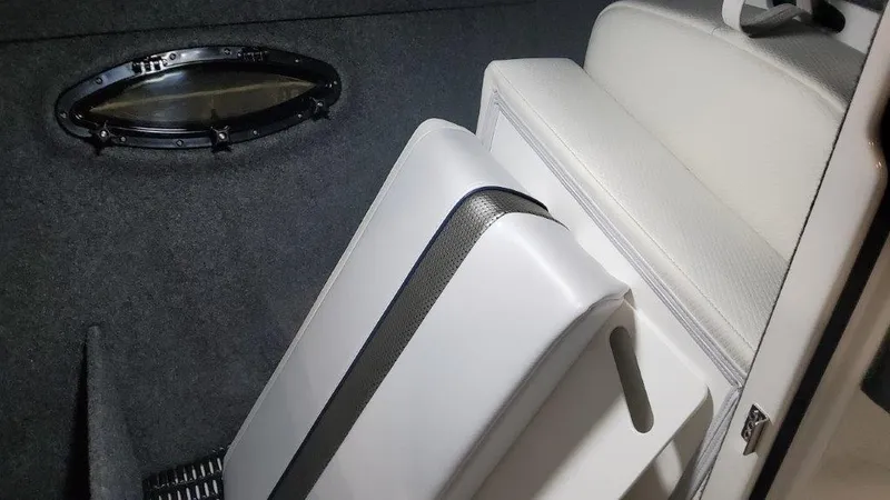Slide: The Image of 2024 Formula 270 Bowrider interior with white seating and oval window. - 41