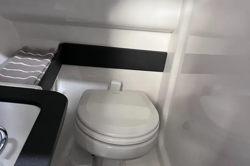 Slide: The Image of 2024 Formula 270 Bowrider interior bathroom with modern toilet and sink. - 43