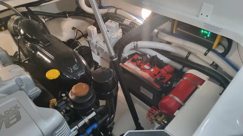 Slide: The Image of 2024 Formula 270 Bowrider engine compartment with battery and wiring. - 46