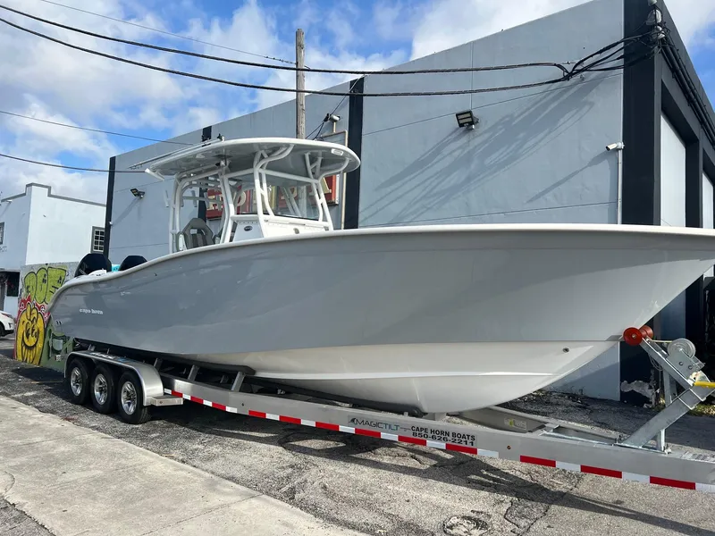 The Image of 2024 Cape Horn 32xs boat on trailer, parked outdoors. - 0