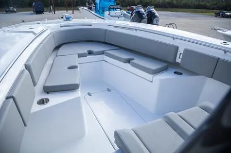 Slide: The Image of 2024 Cape Horn 32xs boat interior with gray seating and spacious layout. - 5