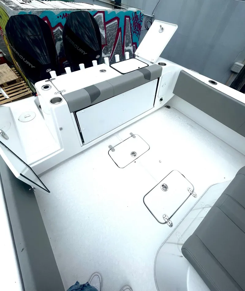 Slide: The Image of 2024 Cape Horn 32xs boat interior with dual engines and spacious seating. - 8