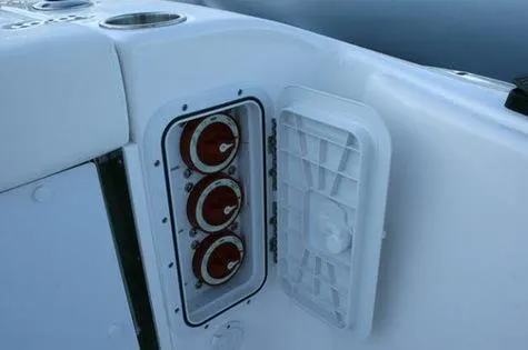 Slide: The Image of 2024 Cape Horn 32xs boat control panel with open access hatch. - 10